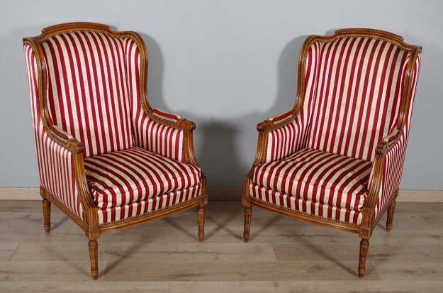 French Louis XVI Style Walnut Bergères à Oreilles with Fluted Legs, a Pair -- DLW